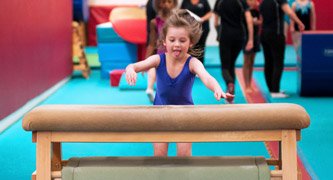 gymnast running at vault horse